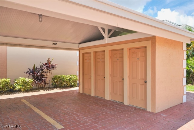1124 SW 48th Ter Unit 208, Cape Coral, FL 33914 - view of exterior entry with stucco siding