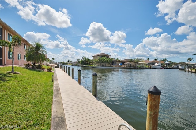 1124 SW 48th Ter Unit 208, Cape Coral, FL 33914 - dock area featuring a lawn and a water view