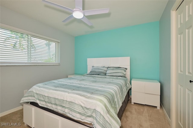 1124 SW 48th Ter Unit 208, Cape Coral, FL 33914 - bedroom featuring light colored carpet, baseboards, and ceiling fan