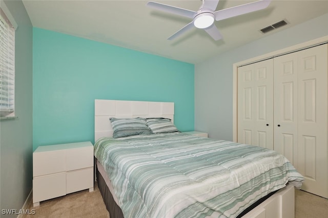 1124 SW 48th Ter Unit 208, Cape Coral, FL 33914 - bedroom featuring light colored carpet, a closet, a ceiling fan, and baseboards