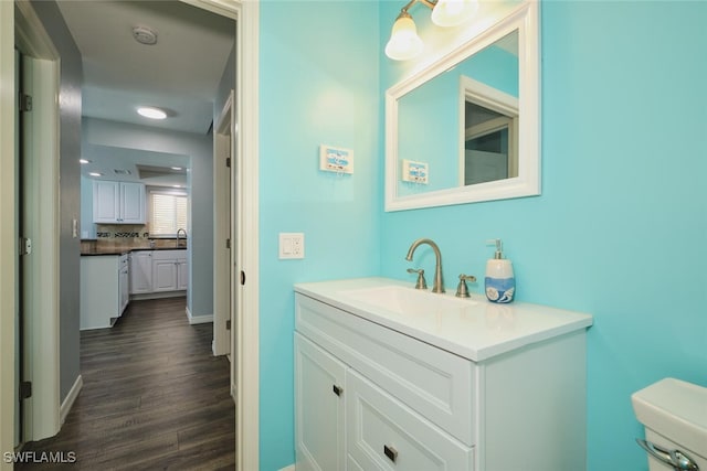 1124 SW 48th Ter Unit 208, Cape Coral, FL 33914 - bathroom with vanity, wood finished floors, and toilet