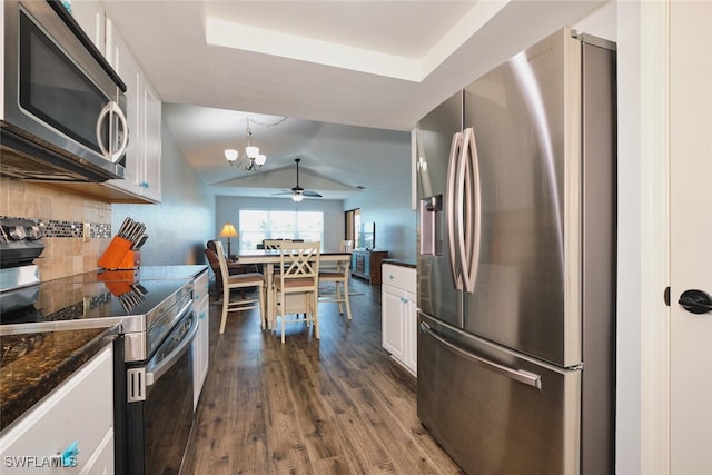 1124 SW 48th Ter Unit 208, Cape Coral, FL 33914 - kitchen with appliances with stainless steel finishes, dark wood-style flooring, decorative backsplash, a chandelier, and white cabinets
