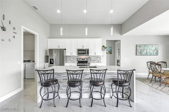 1409 SW 24th St, Cape Coral, FL 33991 - kitchen featuring stainless steel appliances, light marble finish floors, baseboards, light countertops, and recessed lighting