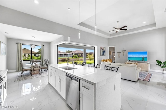 1409 SW 24th St, Cape Coral, FL 33991 - kitchen featuring dishwasher, light marble finish flooring, a sink, a tray ceiling, and white cabinets