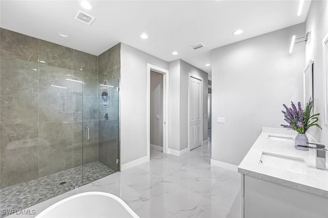 1409 SW 24th St, Cape Coral, FL 33991 - full bath featuring baseboards, marble tiled floors, recessed lighting, a shower stall, and a soaking tub