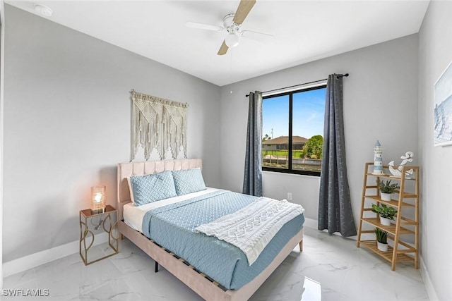 1409 SW 24th St, Cape Coral, FL 33991 - bedroom with light marble finish flooring, baseboards, and ceiling fan