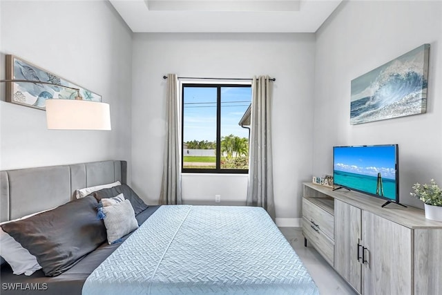 1409 SW 24th St, Cape Coral, FL 33991 - bedroom featuring baseboards and a tray ceiling