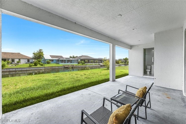 1409 SW 24th St, Cape Coral, FL 33991 - view of patio / terrace with a water view and a residential view