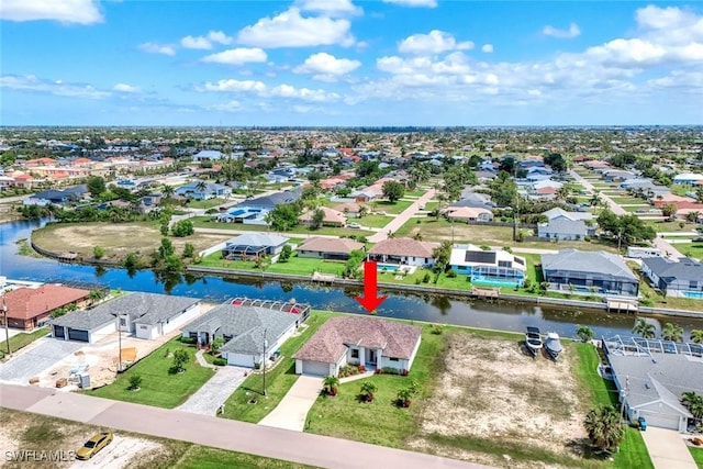1409 SW 24th St, Cape Coral, FL 33991 - aerial perspective of suburban area featuring a large body of water