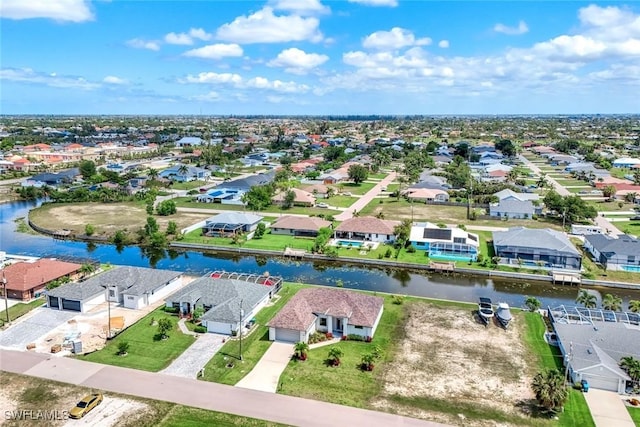 1409 SW 24th St, Cape Coral, FL 33991 - aerial perspective of suburban area featuring a large body of water