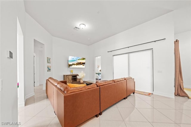 3410 NW 17th Ln, Cape Coral, FL 33993 - living room with light tile patterned floors and baseboards
