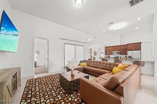 3410 NW 17th Ln, Cape Coral, FL 33993 - living area featuring light tile patterned floors, recessed lighting, and baseboards