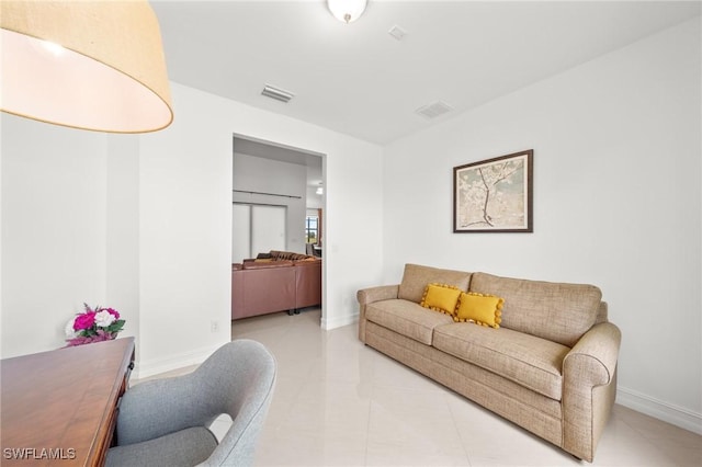 3410 NW 17th Ln, Cape Coral, FL 33993 - living room with light tile patterned floors and baseboards
