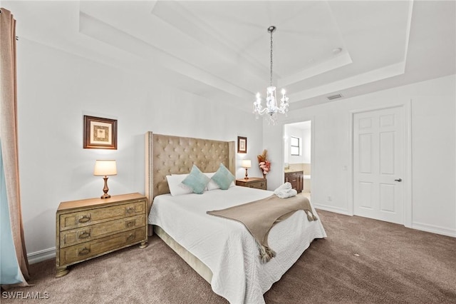 3410 NW 17th Ln, Cape Coral, FL 33993 - carpeted bedroom with a raised ceiling, a chandelier, and ensuite bath