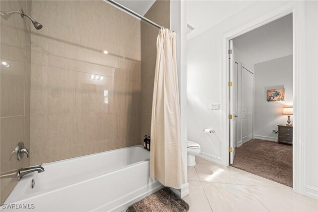 3410 NW 17th Ln, Cape Coral, FL 33993 - full bathroom with shower / bathtub combination with curtain, toilet, baseboards, and tile patterned floors