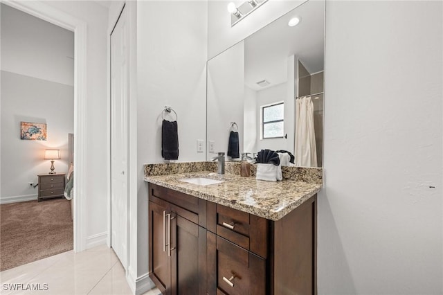 3410 NW 17th Ln, Cape Coral, FL 33993 - bathroom with vanity, connected bathroom, and baseboards