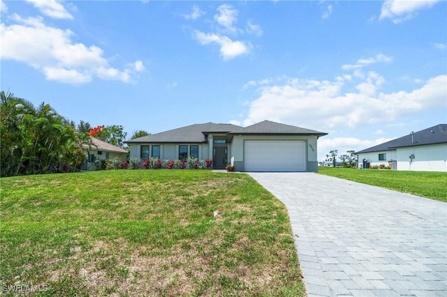 3410 NW 17th Ln, Cape Coral, FL 33993 - view of front of house featuring an attached garage, decorative driveway, a front yard, and stucco siding