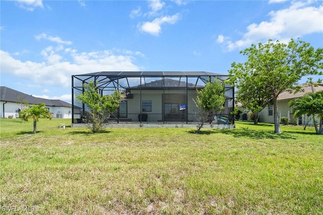 3410 NW 17th Ln, Cape Coral, FL 33993 - back of house with a lawn and a lanai