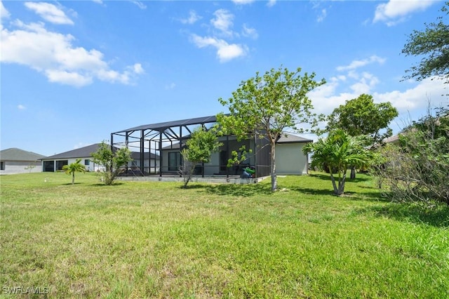 3410 NW 17th Ln, Cape Coral, FL 33993 - view of green lawn featuring glass enclosure