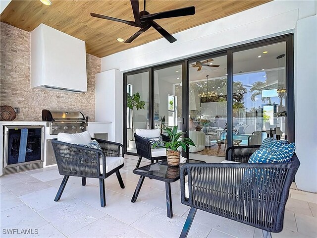 857 95th Ave N, Naples, FL 34108 - view of patio featuring an outdoor hangout area, grilling area, a ceiling fan, and beverage cooler