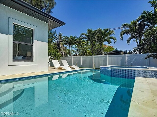 857 95th Ave N, Naples, FL 34108 - view of swimming pool featuring a pool with connected hot tub