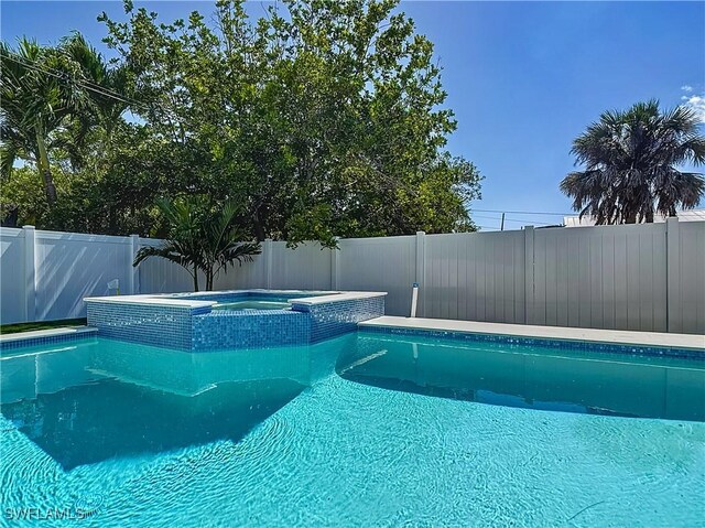 857 95th Ave N, Naples, FL 34108 - view of pool featuring a pool with connected hot tub