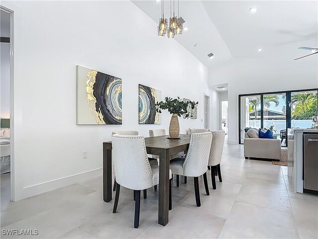 857 95th Ave N, Naples, FL 34108 - dining area featuring a chandelier, high vaulted ceiling, recessed lighting, and baseboards