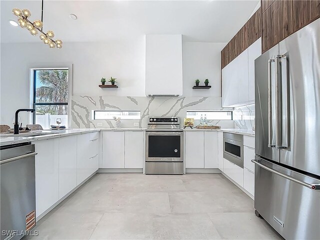 857 95th Ave N, Naples, FL 34108 - kitchen featuring stainless steel appliances, modern cabinets, and white cabinets