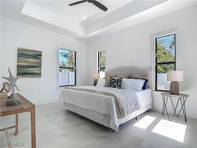 857 95th Ave N, Naples, FL 34108 - bedroom featuring multiple windows, a ceiling fan, and baseboards