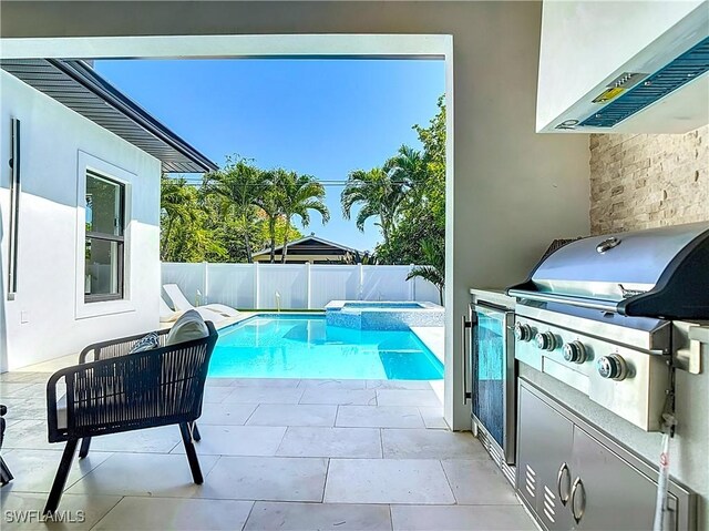 857 95th Ave N, Naples, FL 34108 - view of pool featuring a grill, a fenced backyard, a patio, and a pool with connected hot tub