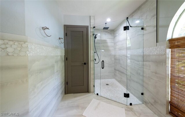 2535 River Reach Dr, Naples, FL 34104 - full bath with tile walls and a stall shower
