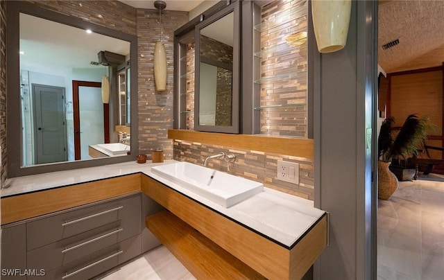 2535 River Reach Dr, Naples, FL 34104 - bathroom with tasteful backsplash and vanity