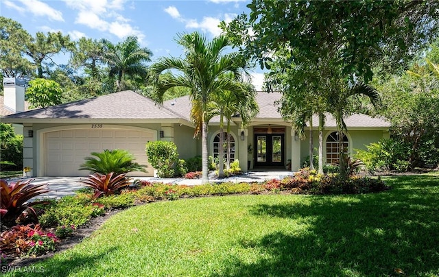 2535 River Reach Dr, Naples, FL 34104 - ranch-style house with french doors, a garage, a front yard, stucco siding, and a chimney