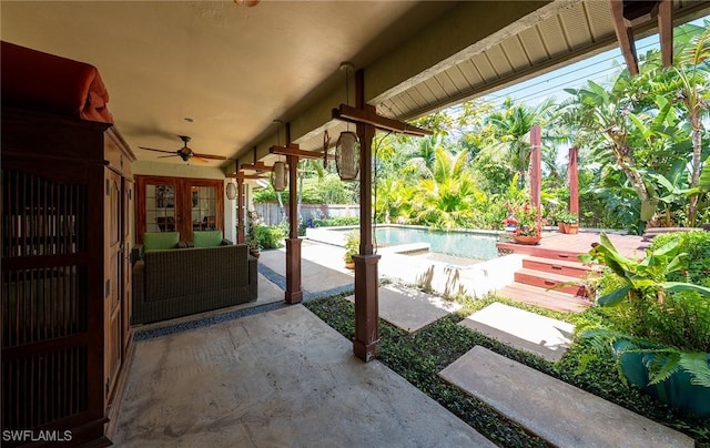 2535 River Reach Dr, Naples, FL 34104 - view of patio / terrace featuring a ceiling fan and an outdoor pool