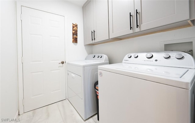 2535 River Reach Dr, Naples, FL 34104 - washroom featuring cabinet space and washing machine and dryer