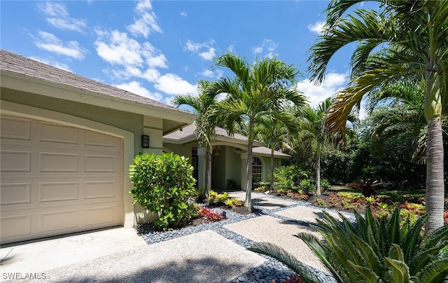 2535 River Reach Dr, Naples, FL 34104 - entrance to property featuring stucco siding and a garage