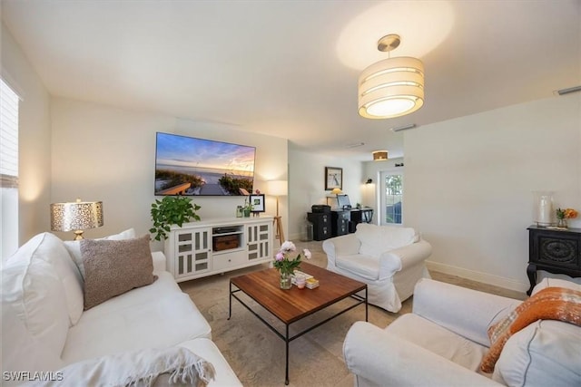 2777 Clipper Way, Naples, FL 34104 - living room with healthy amount of natural light and baseboards