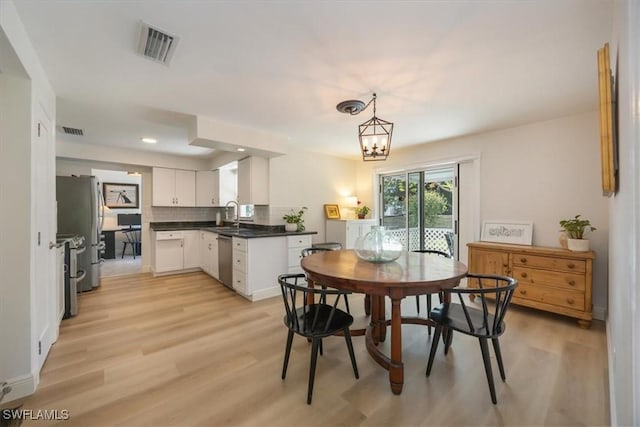 2777 Clipper Way, Naples, FL 34104 - dining space featuring light wood-style floors and recessed lighting