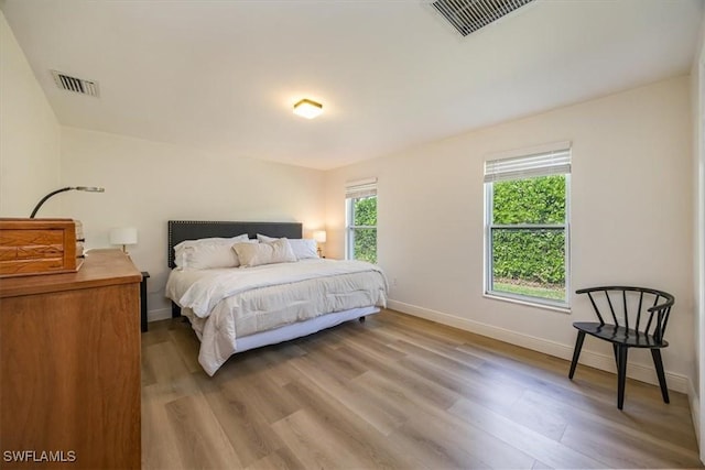 2777 Clipper Way, Naples, FL 34104 - bedroom with light wood-style floors and baseboards