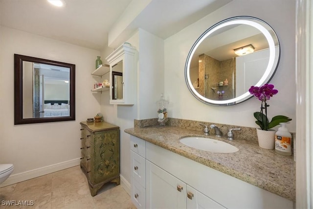 2777 Clipper Way, Naples, FL 34104 - bathroom with baseboards, vanity, and toilet