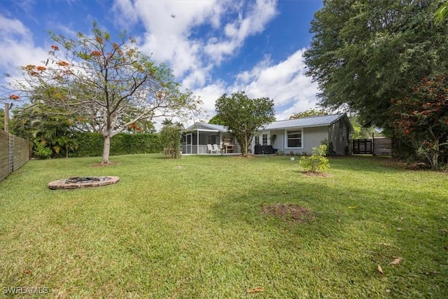 2777 Clipper Way, Naples, FL 34104 - view of yard with a fire pit and a sunroom