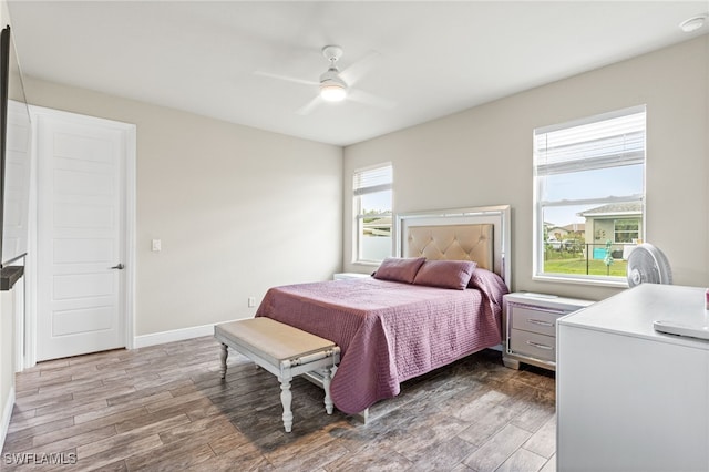 1049 Solar Ct, Labelle, FL 33935 - bedroom featuring wood finished floors, ceiling fan, and baseboards