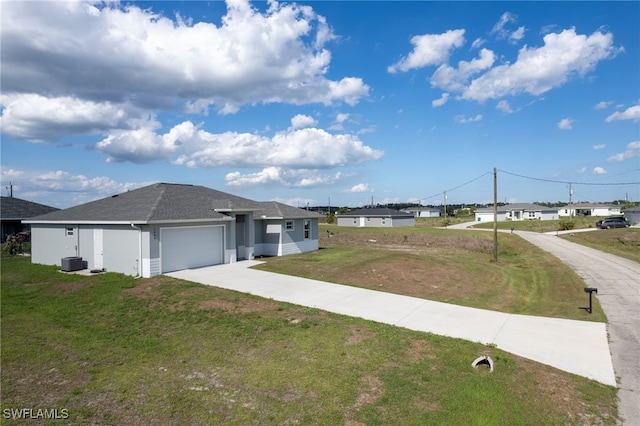 1049 Solar Ct, Labelle, FL 33935 - view of home's exterior featuring an attached garage, driveway, a yard, a shingled roof, and stucco siding
