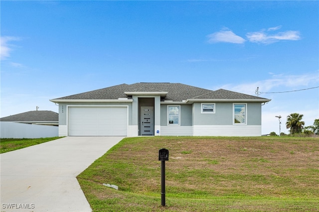 1049 Solar Ct, Labelle, FL 33935 - prairie-style house with driveway, an attached garage, a front lawn, and stucco siding
