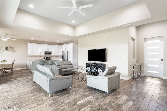 1049 Solar Ct, Labelle, FL 33935 - living room featuring ceiling fan, wood finished floors, recessed lighting, and baseboards