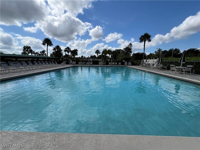 4186 27th Ct SW Unit 105, Naples, FL 34116 - community pool with a patio area