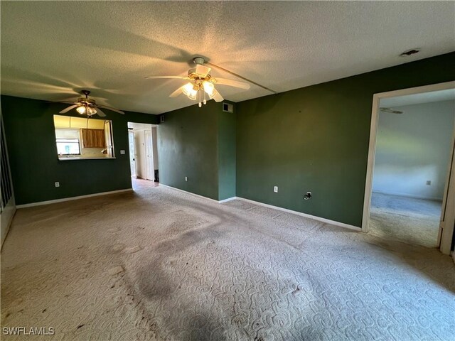 4186 27th Ct SW Unit 105, Naples, FL 34116 - unfurnished room featuring a ceiling fan, carpet, a textured ceiling, and baseboards