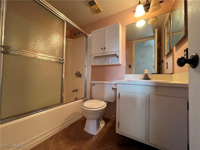 4186 27th Ct SW Unit 105, Naples, FL 34116 - full bath featuring vanity, bath / shower combo with glass door, toilet, and tile patterned flooring