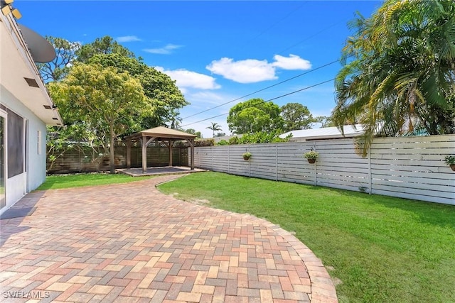 7709 1st Ter, Lake Worth, FL 33463 - view of yard with a gazebo and a patio area