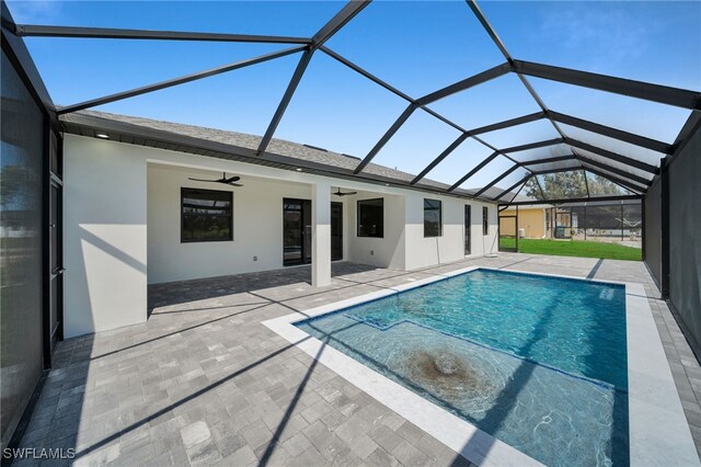 419 NW 7th Ave, Cape Coral, FL 33993 - swimming pool featuring a ceiling fan, a patio, and a lanai